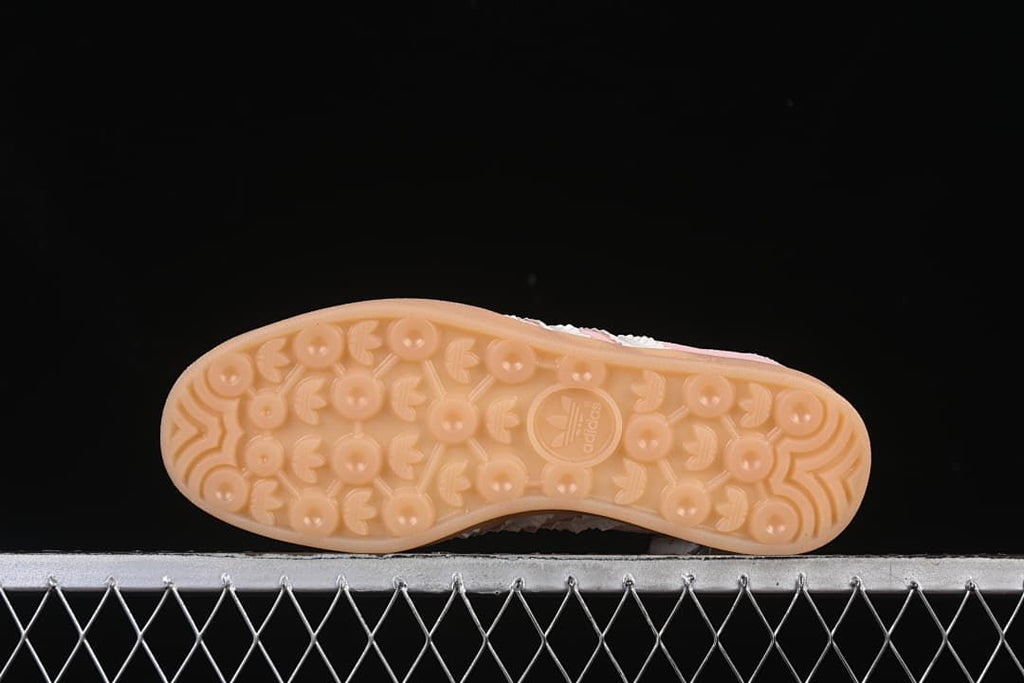 Underside showing the gum-colored patterned outsole