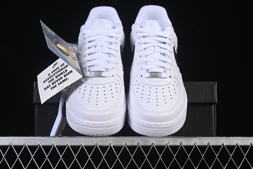 Front view of both sneakers with perforated toes and hangtag
