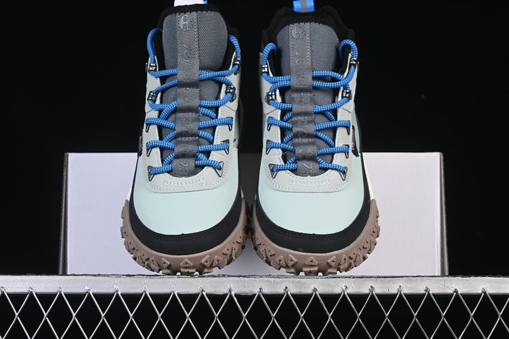 Front view of the pair showing the toe shape, laces, and lugged outsoles