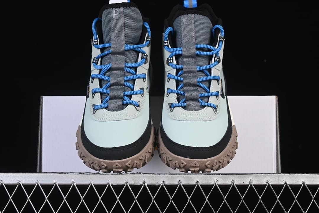 Front view of the pair showing the toe shape, laces, and lugged outsoles