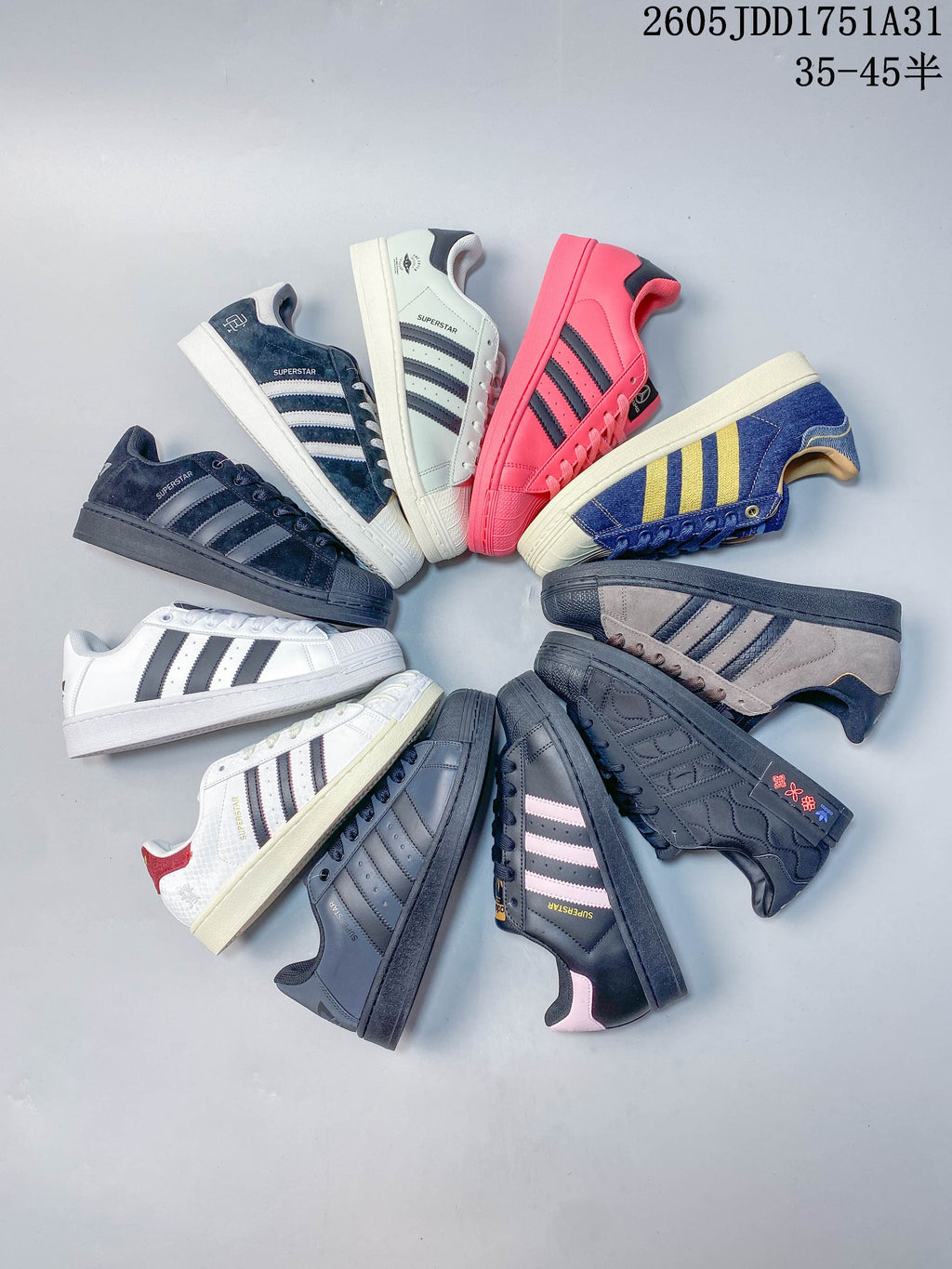 Overhead arrangement of assorted Superstar-style sneakers in different colors and finishes