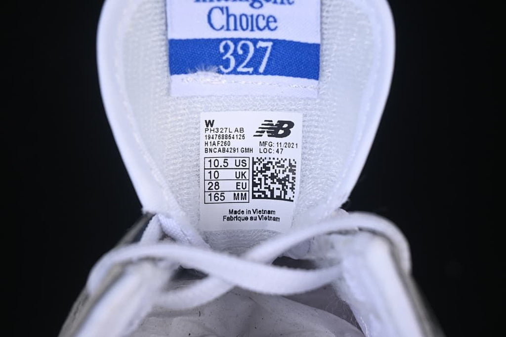 Tongue label on the New Balance 327 sample showing EU 28, UK 10, US 10.5, and 165 mm.