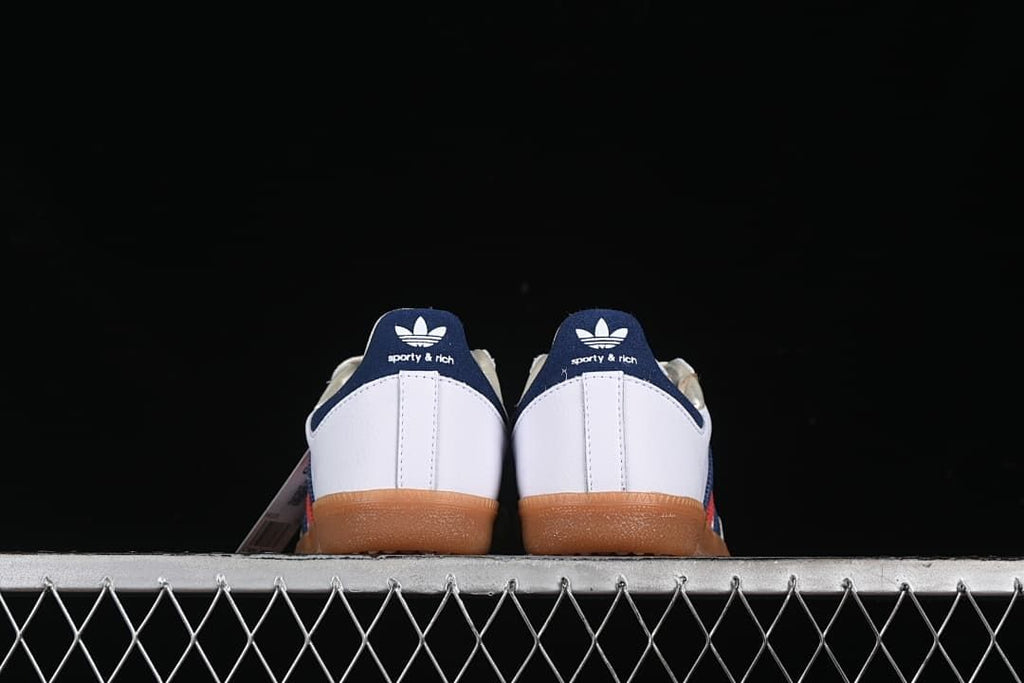Rear view of the pair with navy heel tabs and gum-colored soles