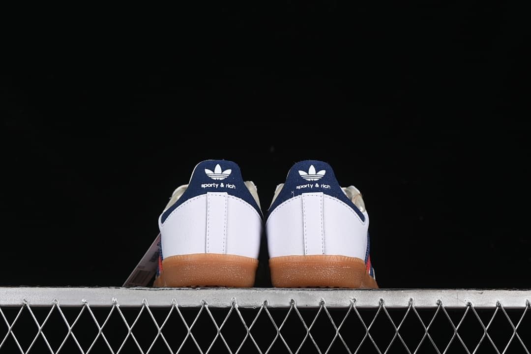 Rear view of the pair with navy heel tabs and gum-colored soles