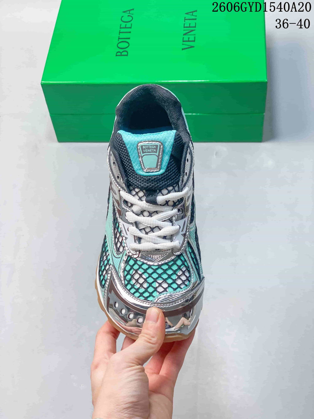 Front view highlighting white laces, patterned panels, and silver-tone overlays