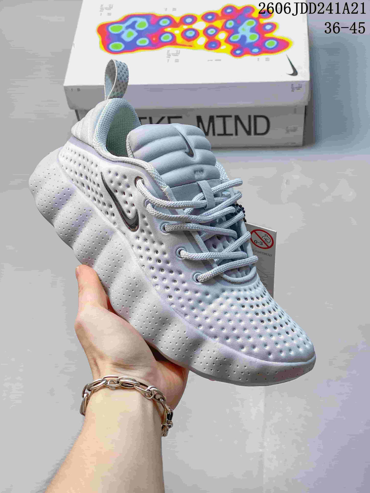 Light-colored Nike Mind 002 SP FK shoe with a sculpted thick outsole.