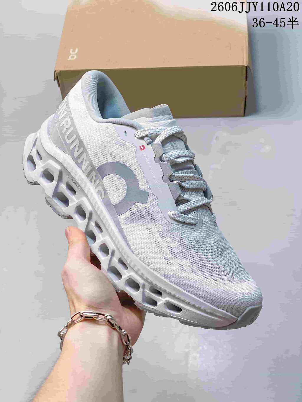 Light gray On running shoe with pale blue and lavender details