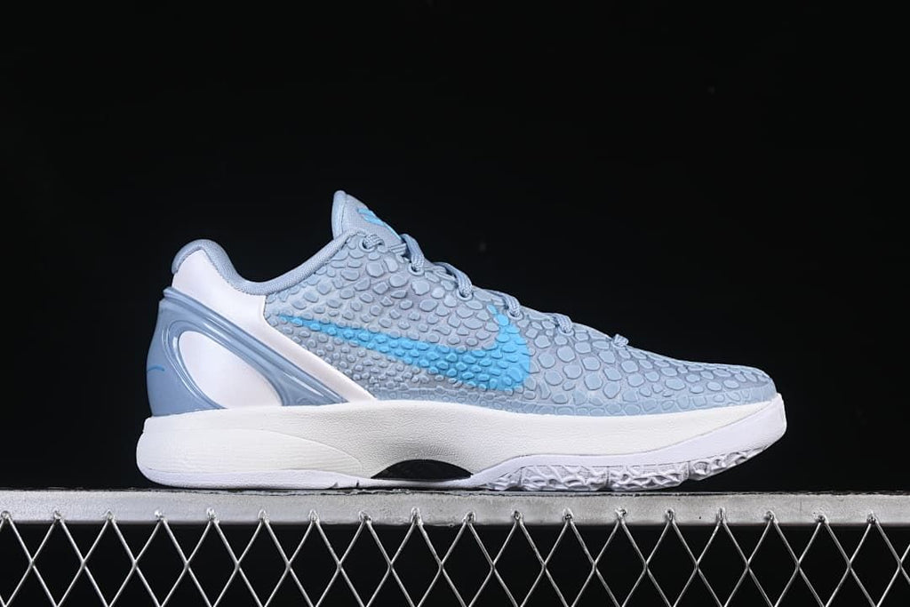Side profile highlighting the blue Swoosh and white midsole
