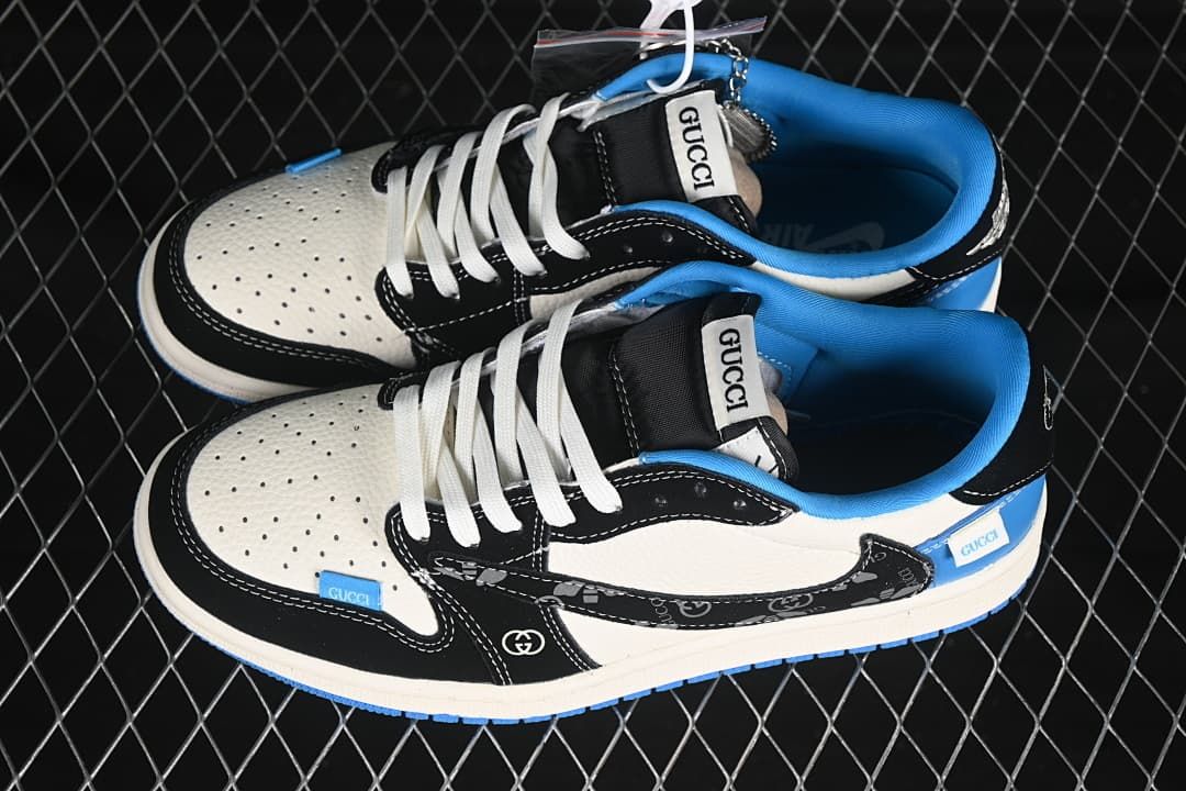 Pair of blue, black and off-white low-top sneakers shown from above, with white laces and visible Gucci-branded details.