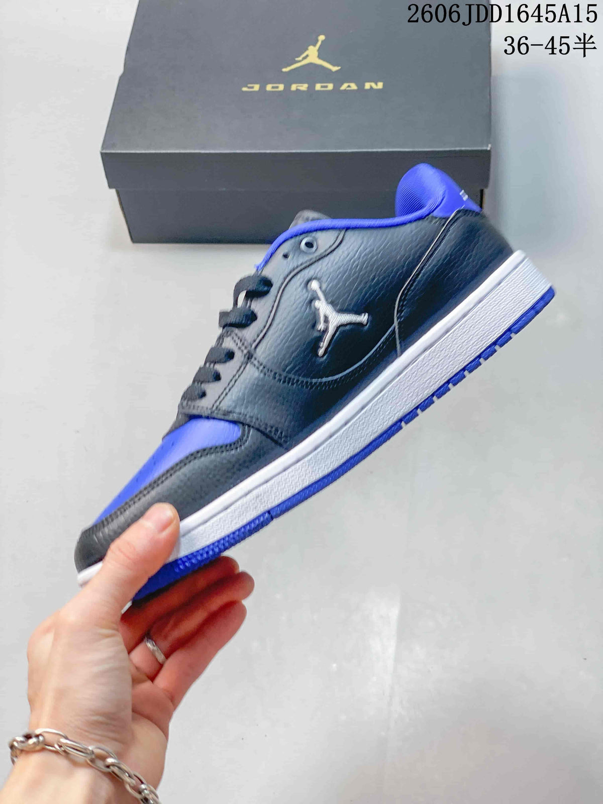 Side view of the charcoal and blue Jordan Court Connect low-top sneaker