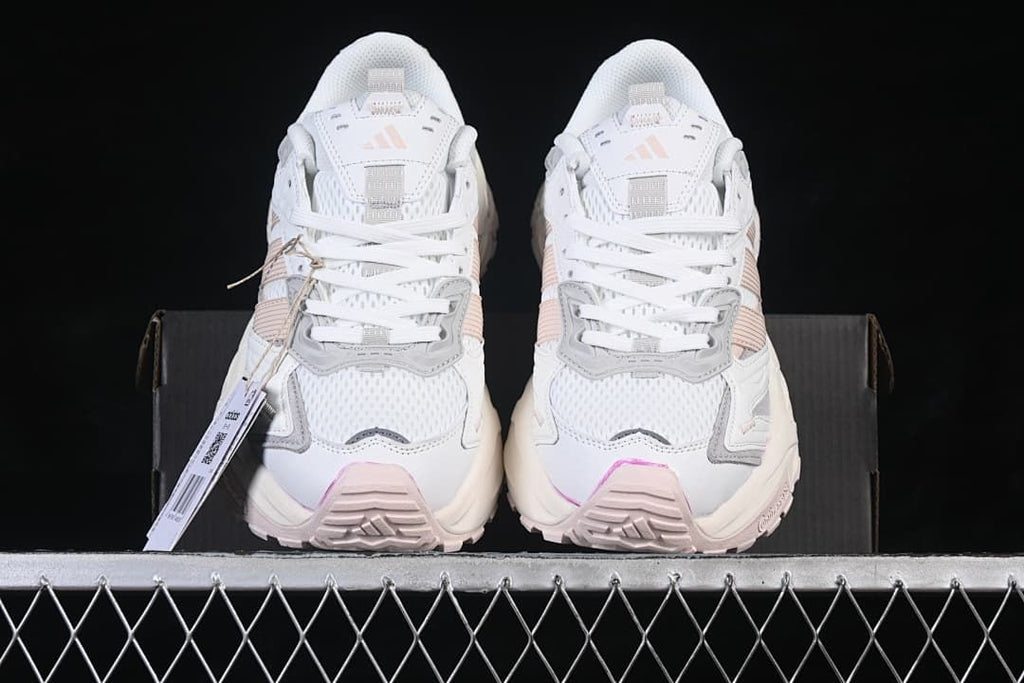 Front view of the pair showing the laces, toe panels and pink accents