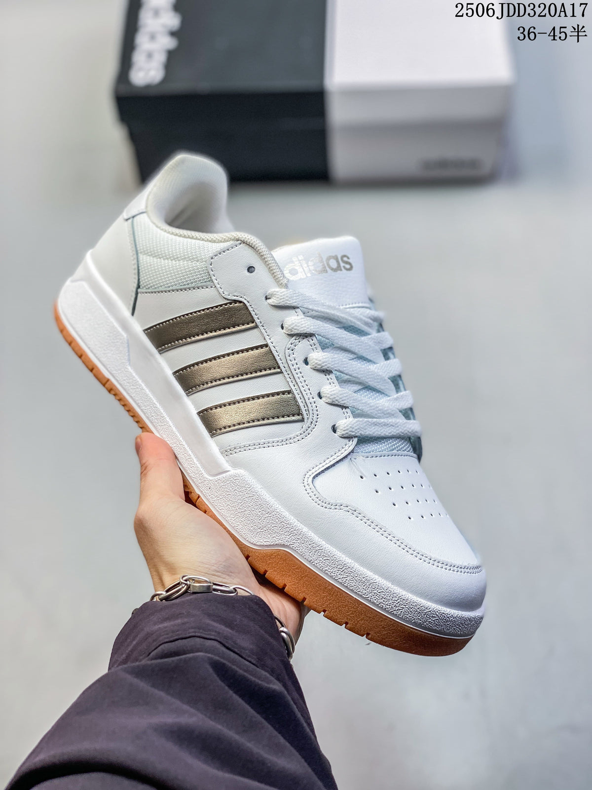 White adidas Entrap sneaker with metallic-tone stripes and gum outsole.