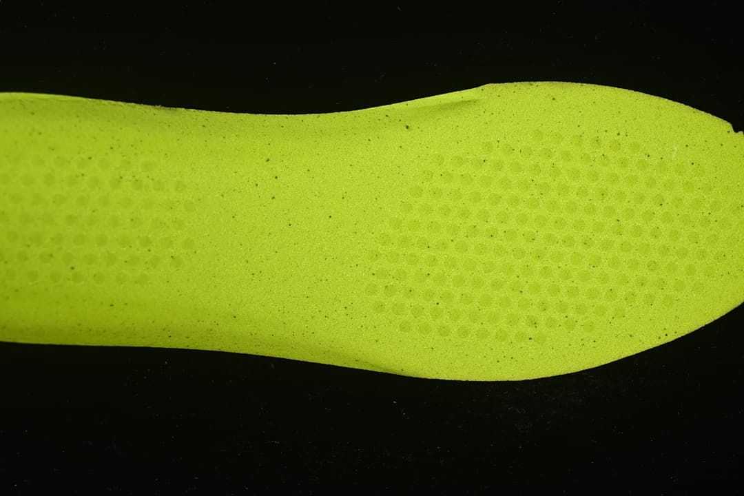 Bright yellow-green shoe insert shown separately