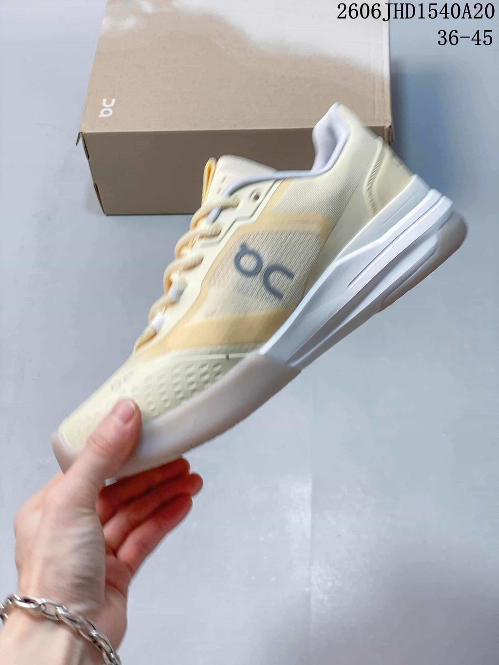 Side profile of the cream On The Roger Adv Pro tennis shoe