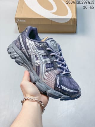 ASICS low-top sneaker in a dark gray and silver colorway with a dark outsole.