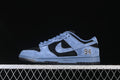 Side profile of a blue and black Nike SB Dunk Low with a Swoosh and 94 heel detail