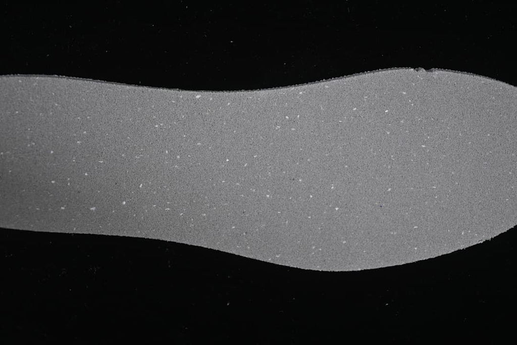Close-up view of a gray footwear component.