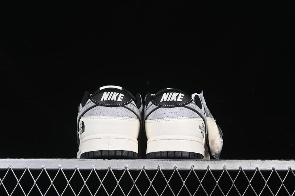 Rear view of the pair with Nike heel tabs and contrasting black outsoles