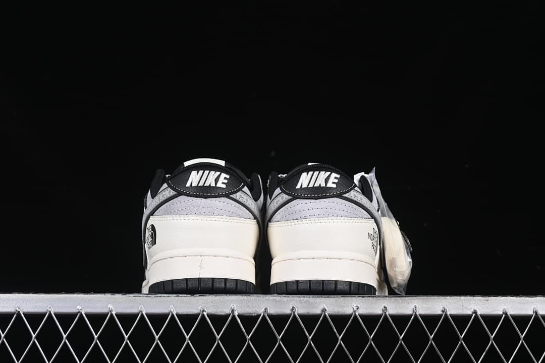 Rear view of the pair with Nike heel tabs and contrasting black outsoles