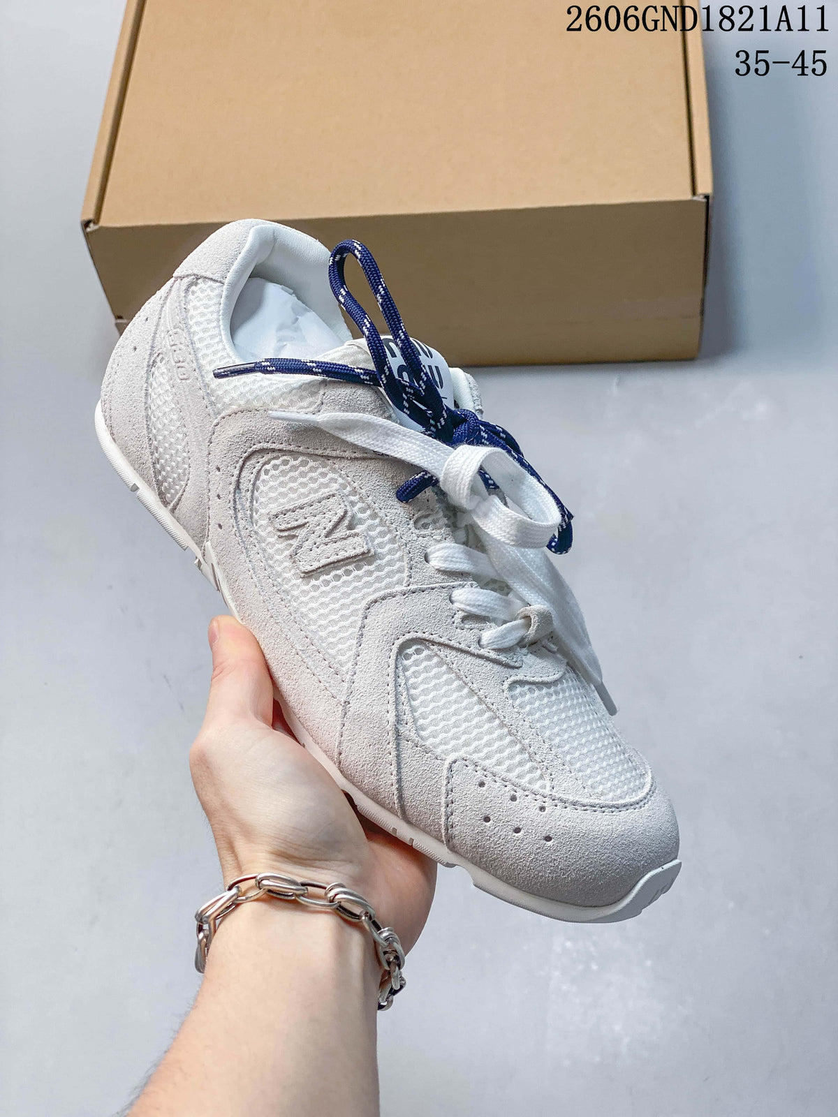 Angled side view highlighting the sneaker's mesh panels and gray overlays