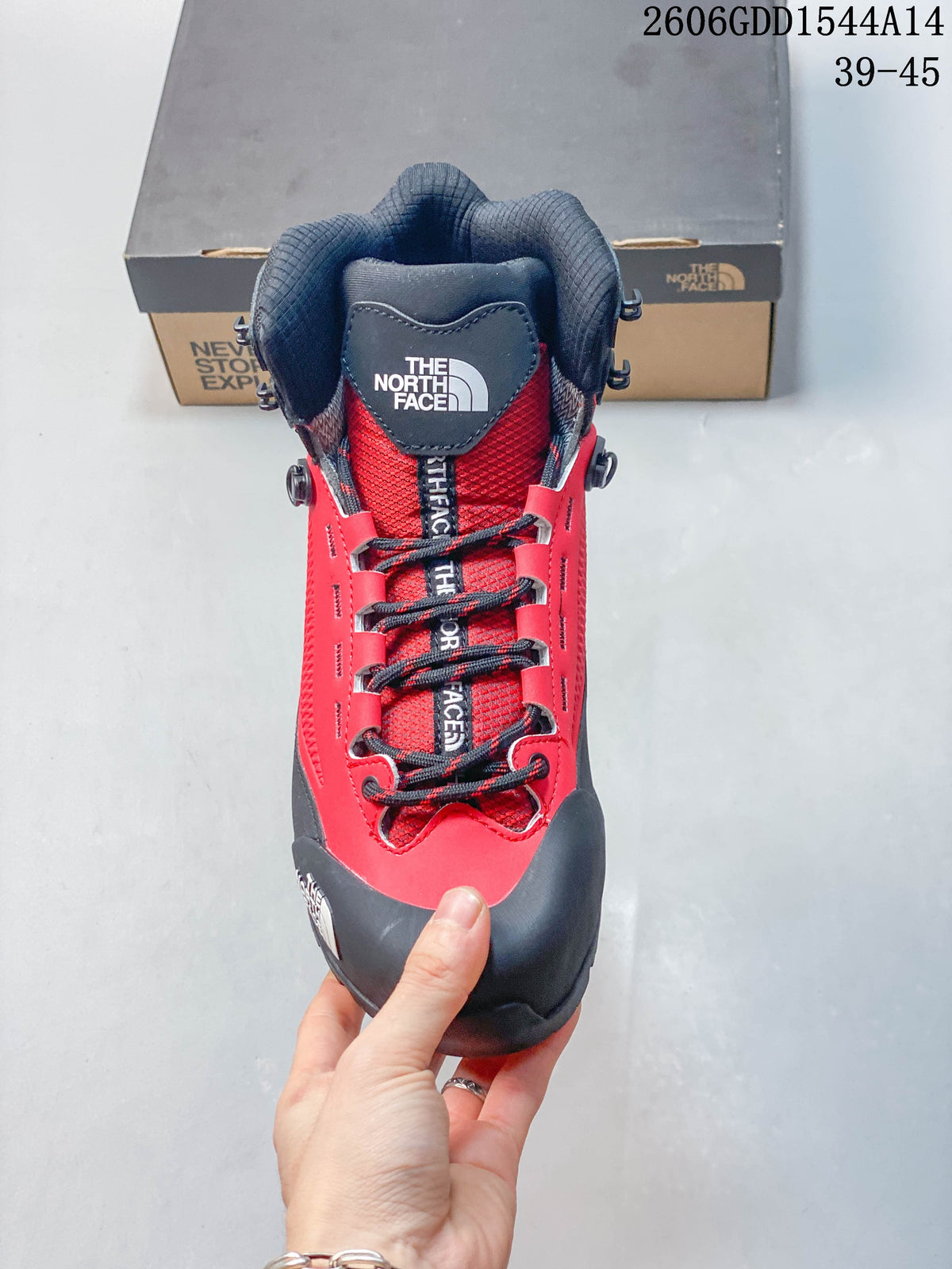 Front view of the red and gray hiking boot with lace-up closure and padded collar