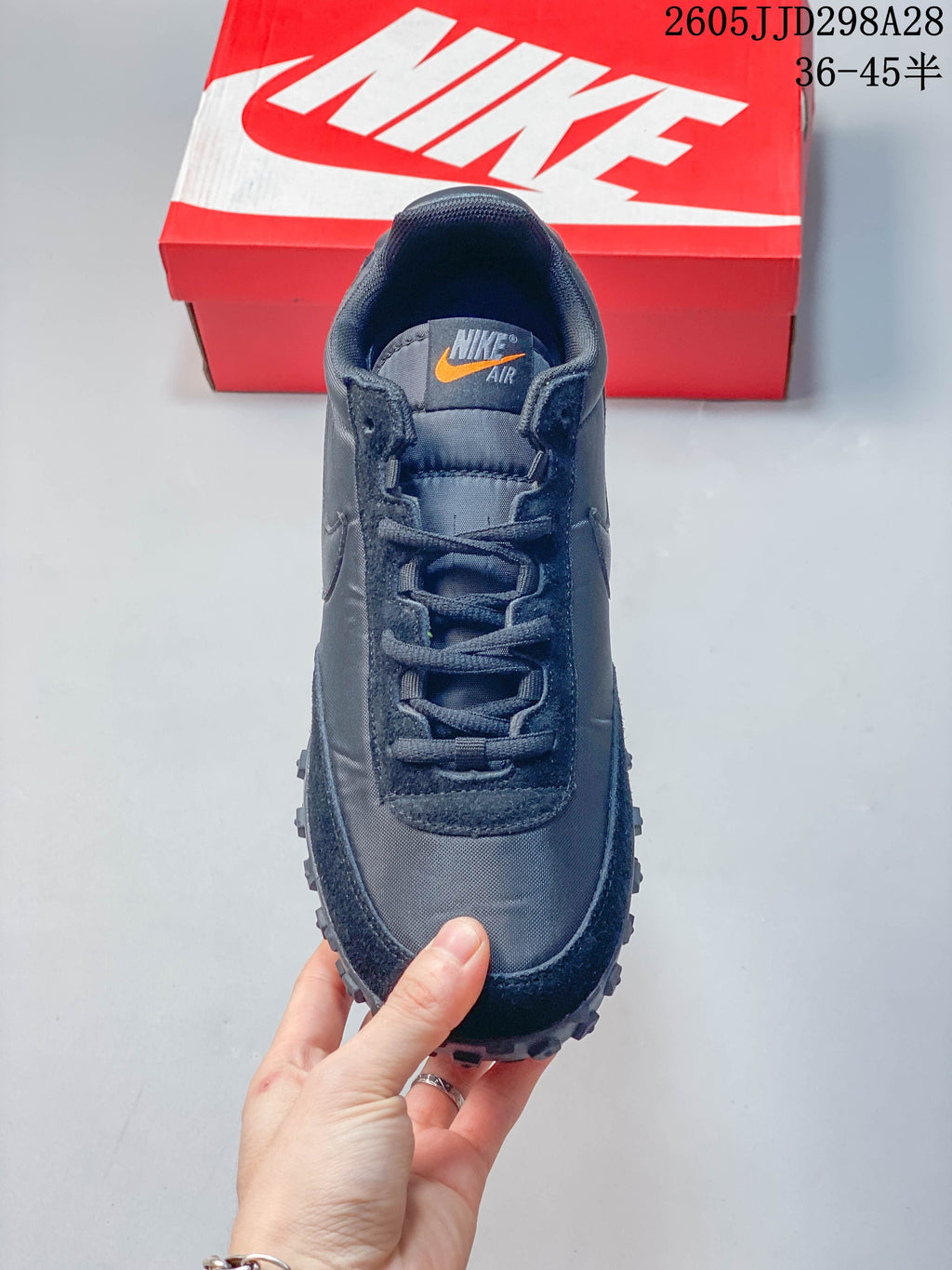 Top view showing the laces, tongue, and orange accent