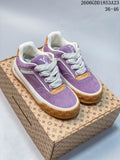 Pair of purple Louis Vuitton Tilted low-top sneakers with white laces and gum-colored soles