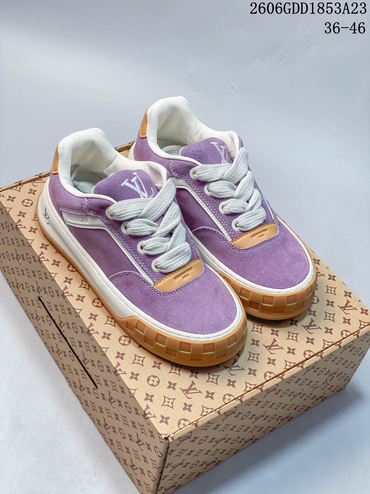 Pair of purple Louis Vuitton Tilted low-top sneakers with white laces and gum-colored soles