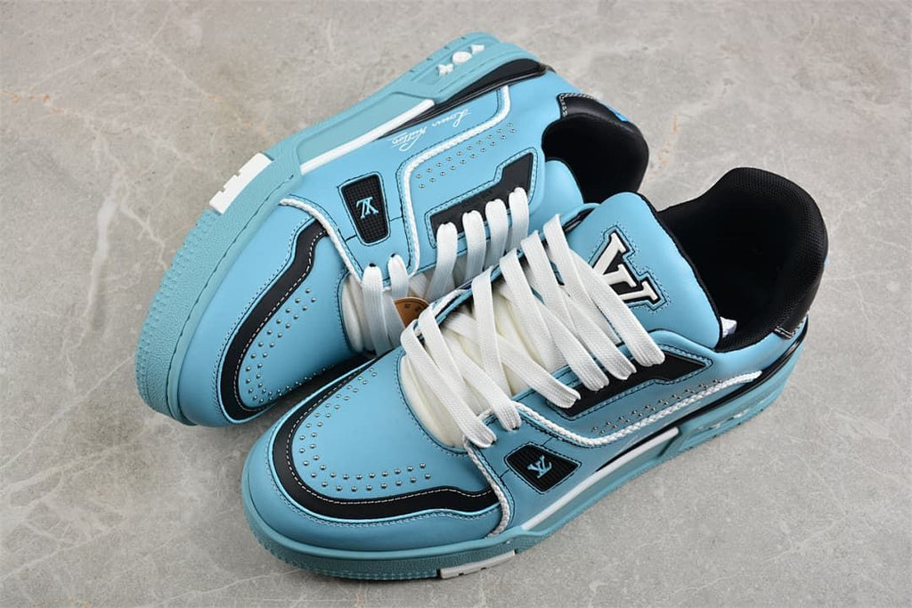 Pair of blue and navy LV Trainer sneakers with white laces and studded details