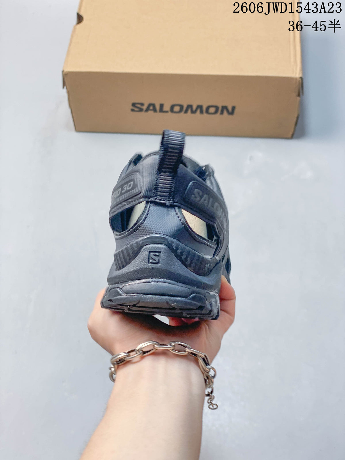 Rear view of a dark gray Salomon XA Pro 3D Amphib shoe.