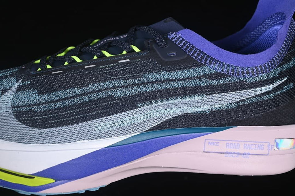 Close-up side view of the patterned upper, laces and sculpted sole.