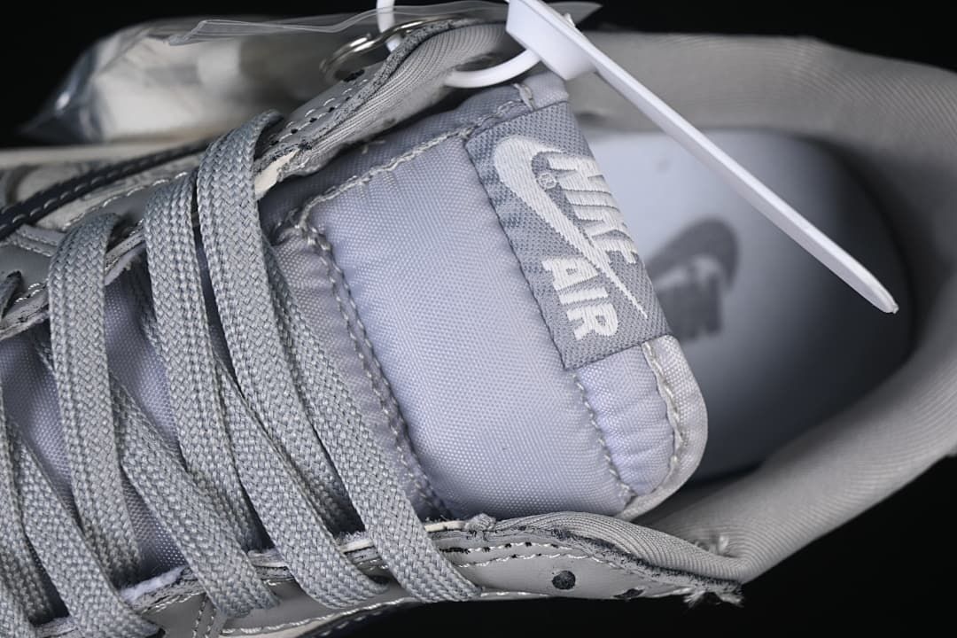 Close-up of the gray tongue, laces, and visible Nike Air branding.