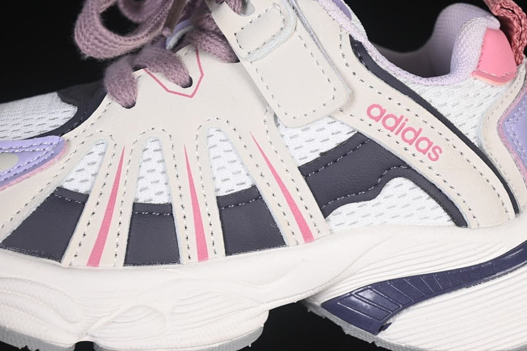 Close-up of the side panels, mesh-look sections, laces, and hook-and-loop strap