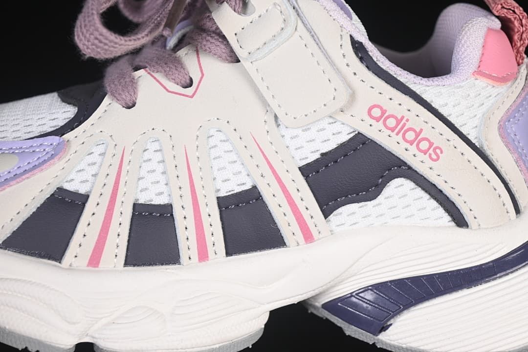 Close-up of the side panels, mesh-look sections, laces, and hook-and-loop strap