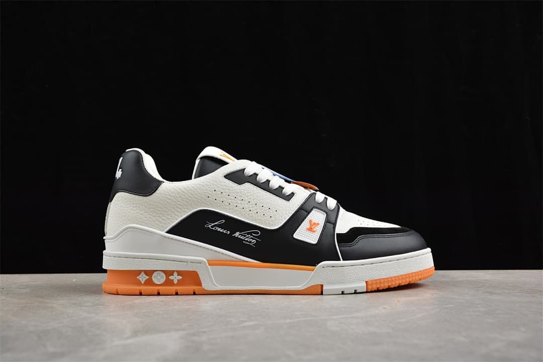 Side view highlighting the perforated upper and orange outsole accents