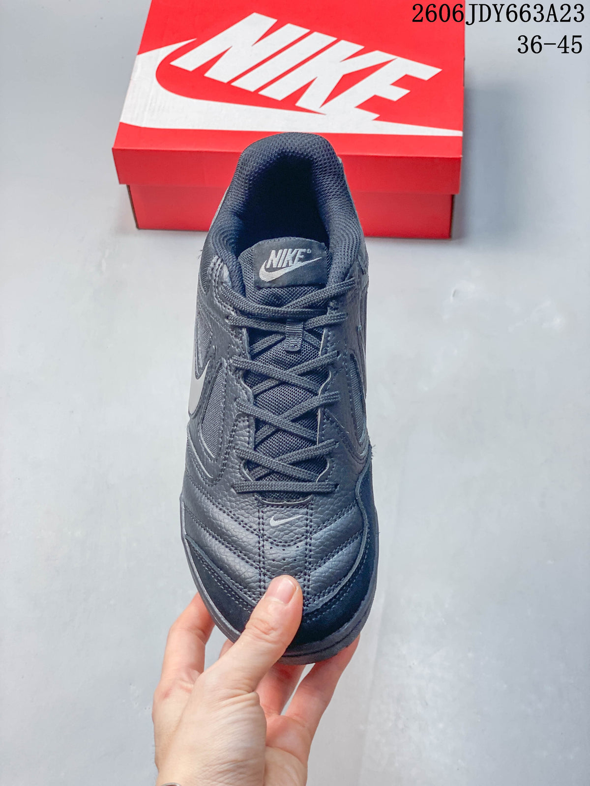 Top view of a dark gray lace-up Nike Gato sneaker