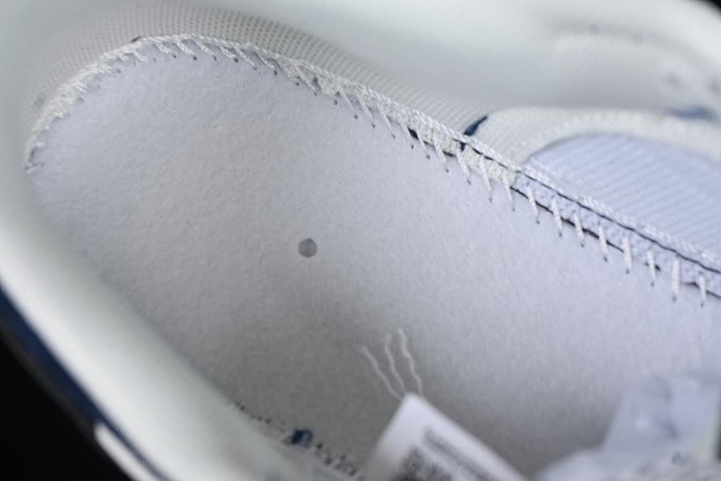 Close-up of the light-colored interior lining and stitching.