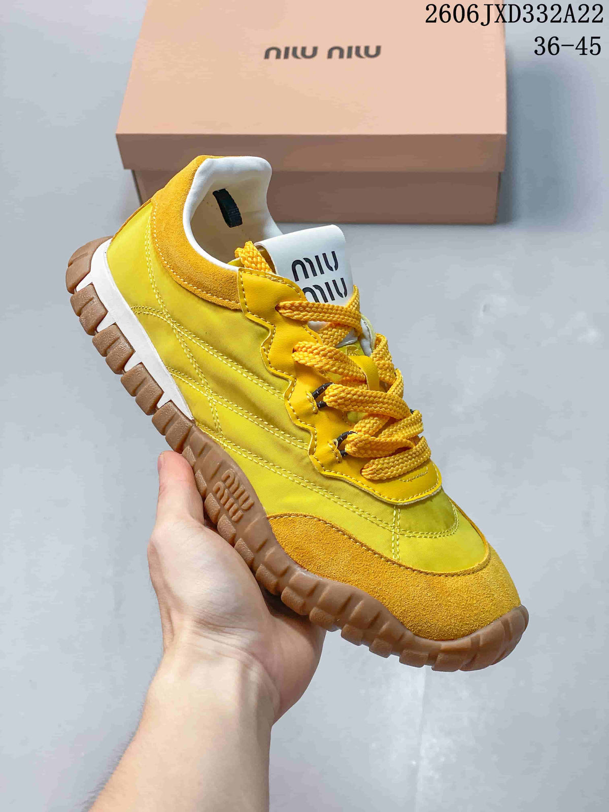 Yellow Miu Miu Tyre low-top sneaker with matching laces and gum-color outsole