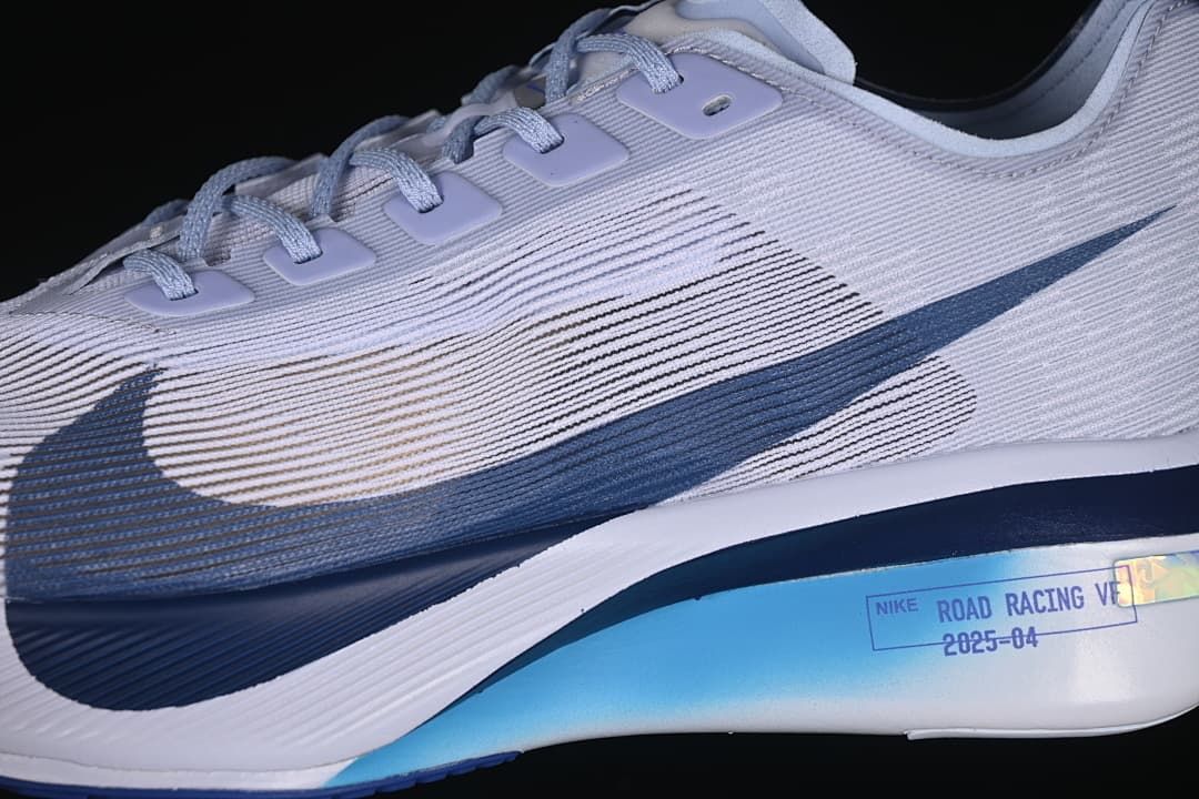 Close-up of the side upper, Swoosh, and sculpted sole