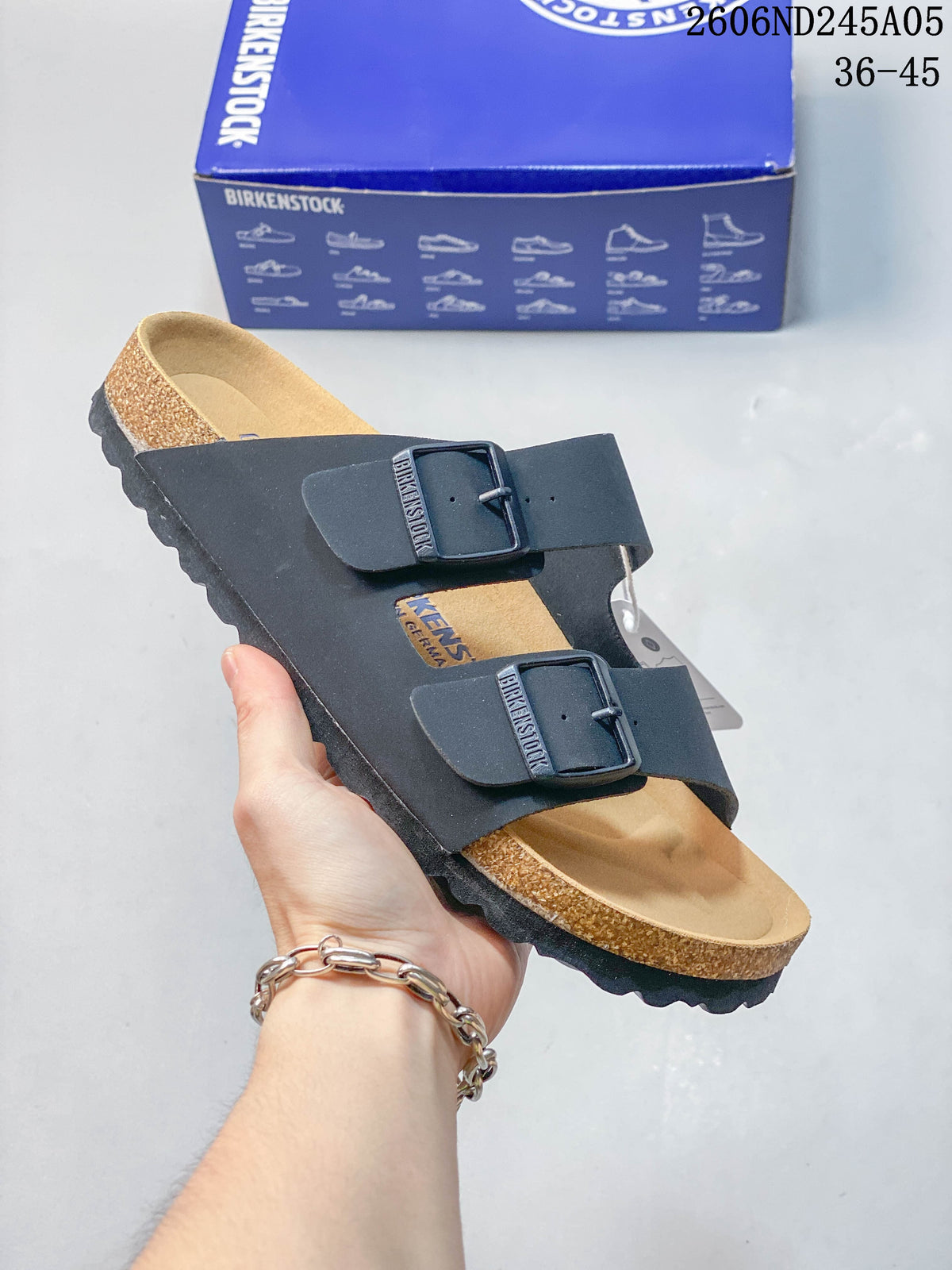 Black two-strap sandal with matching dark buckles.
