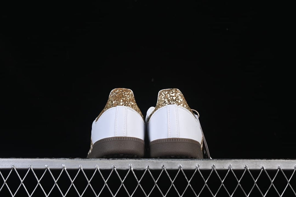 Rear view of the pair showing gold heel accents and gum-colored soles