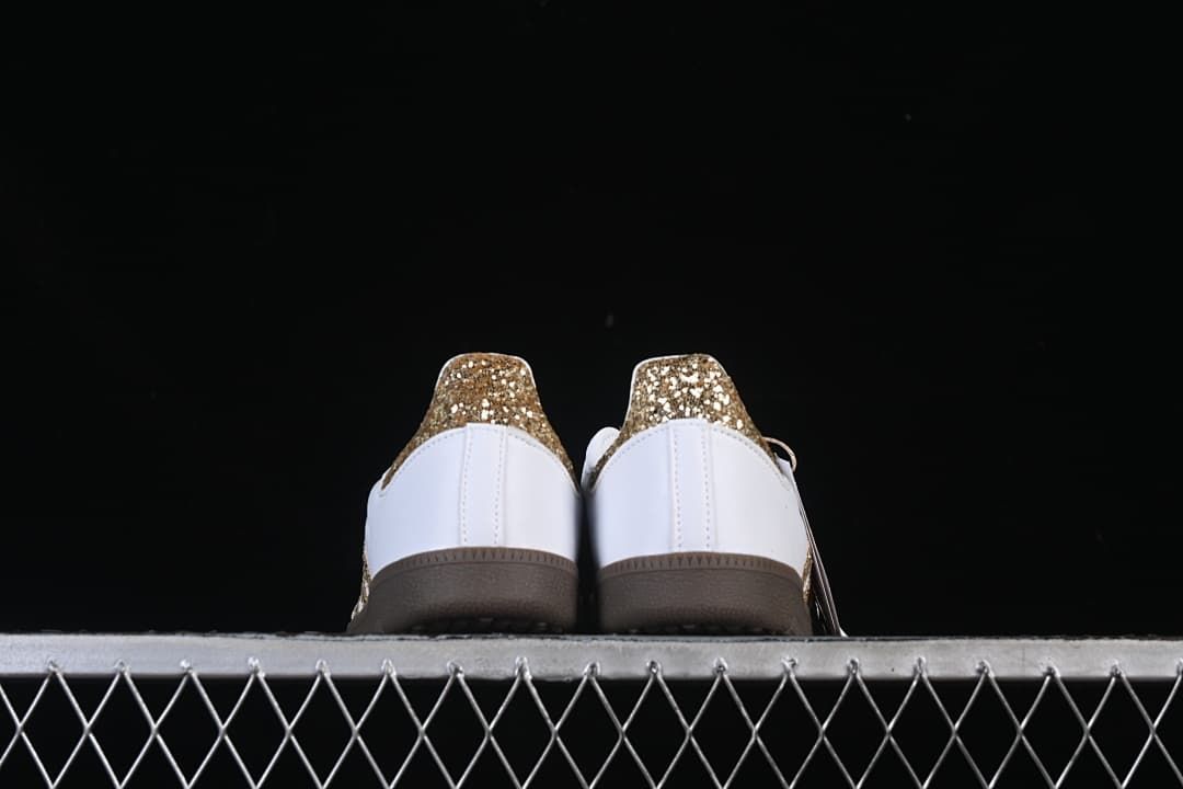 Rear view of the pair showing gold heel accents and gum-colored soles