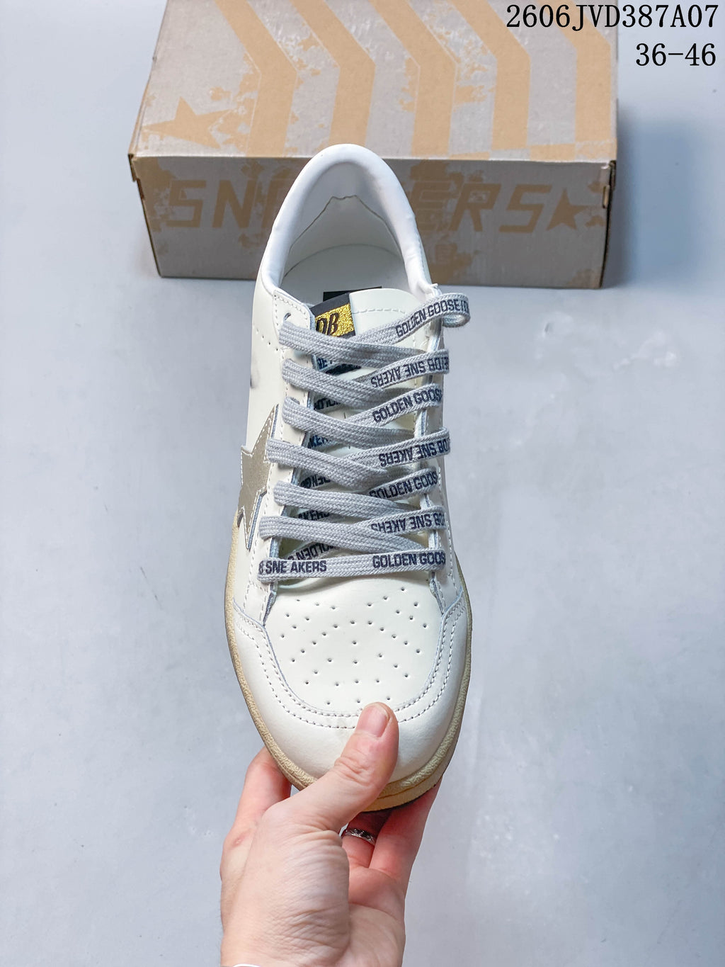 Front view showing the perforated toe and gray printed laces