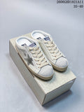 Pair of white Golden Goose Super-Star low-top sneakers with silver star details and beige-toned soles