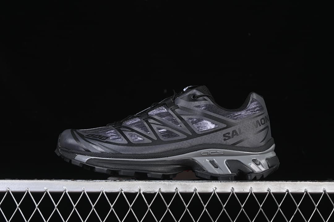 Side view of dark gray Salomon XT-6 Camo sneakers