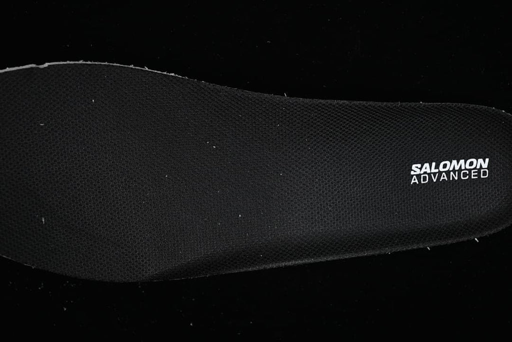 Black insole with Salomon Advanced branding.