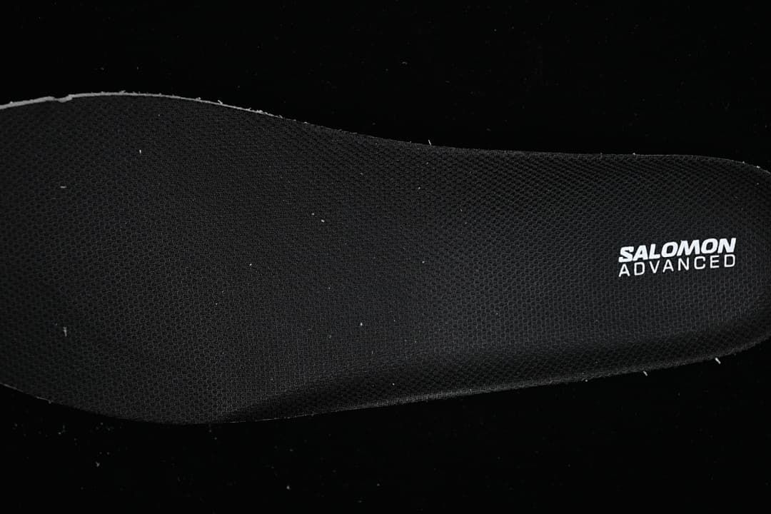 Black insole with Salomon Advanced branding.
