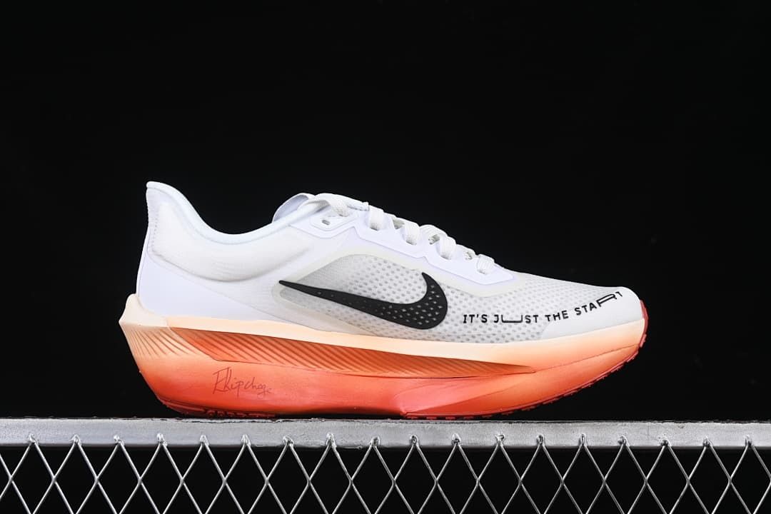 Side profile with white upper, black Swoosh and coral-orange sole