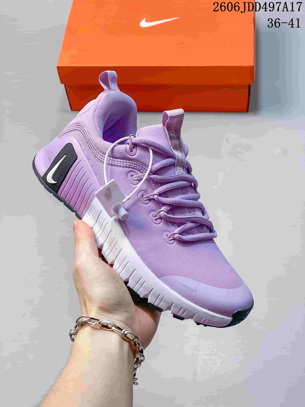 Side view of a lavender Nike Free Metcon 7 shoe with a segmented sole; image overlay shows size range 36–41.