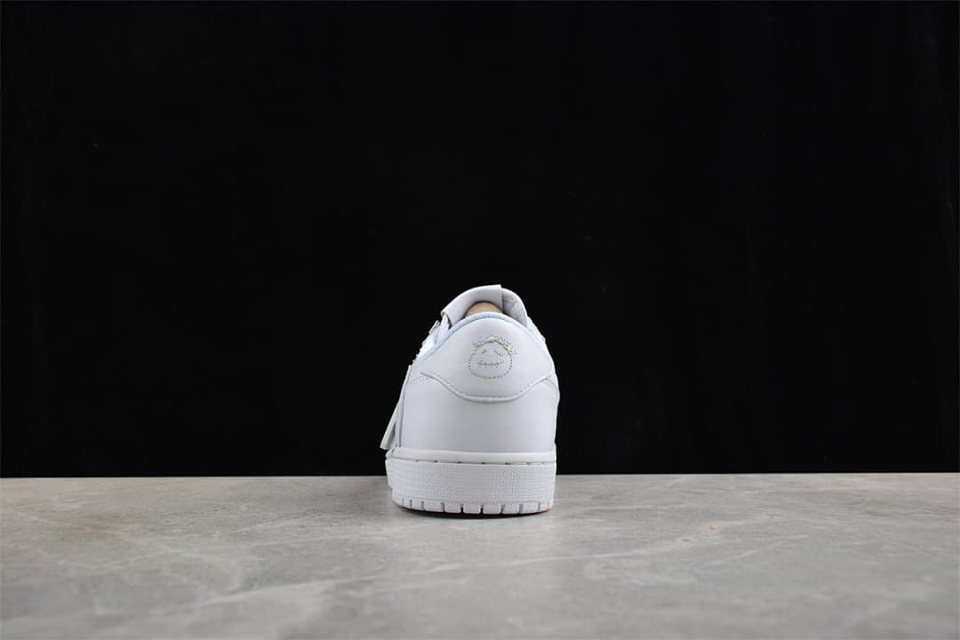 Rear view of the white sneaker and its heel